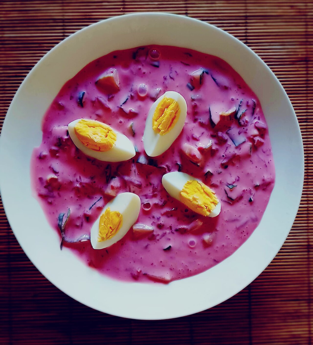 Photoreal photograph of the finished dish Cold beet soup (šaltibarščiai), the actual plate from Lithuania, handmade ceramic, natural window light, shallow depth of field, no text, no logo, no people, Natural window light, ivory linen, handmade ceramic, shallow depth of field, no text, no logo, no watermark, fine-dining magazine photograph. Cold beet soup